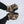 Glacier Glove camouflage winter gloves with black palms worn against a snowy background