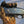Glacier Glove camouflage hunting glove holding a Remington shotgun