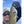 Angler wearing a Bass Pro Shops hat holding a smallmouth bass
