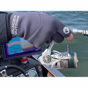 Hand wearing a Glacier Outdoor grey fingerless glove holding a fishing reel on a boat