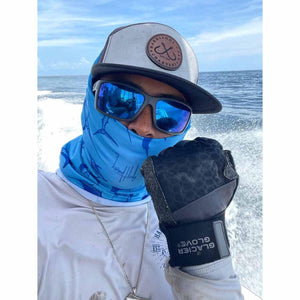 Person wearing Glacier Glove fishing gloves and blue neck gaiter on a boat