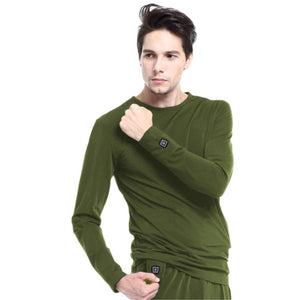 Man wearing olive green Glovii long sleeve thermal shirt with power button on cuff
