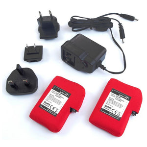 Glovii battery charger kit with two red batteries and multiple international power adapters