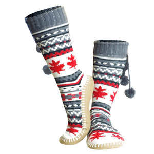 Glovii knee high slipper socks with red maple leaf pattern and grey pom poms