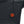 Black quilted fabric with a circular power button glowing red with a heat wave icon