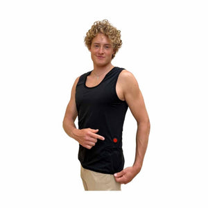 Man wearing a black Glovii heated tank top pointing to the red power button on the side