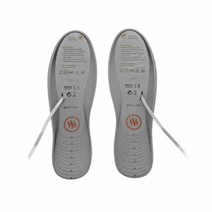 Pair of Glovii heated insoles with size markings and care instructions