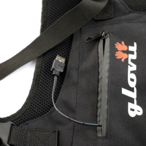 Glovii black vest with an integrated USB charging cable extending from a zippered pocket