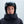 Person wearing a black POC ski helmet and black jacket