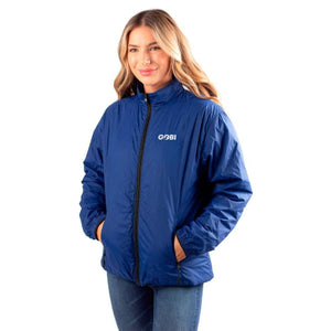 Woman wearing a blue Gobi zip up jacket with a high collar and side pockets
