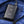 Black Gobi power bank with snowflake logo and LED indicators inside a blue jacket pocket