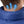 Gobi Heat vest collar with blue arrows indicating heat rising to the neck