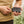 Person holding a black Gobi power bank and connecting a charging cable