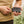 Person plugging a Gobi Heat portable power bank into a jacket pocket