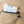 White rectangular ice pack with fill water to this line text inserted into a tan fabric pocket