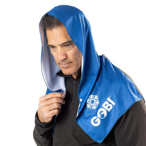 Man wearing a blue Gobi Heat cooling towel over his head