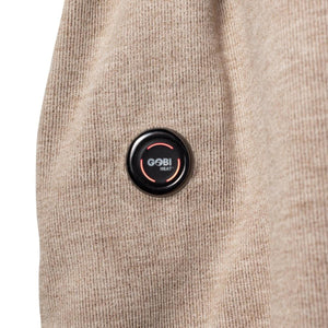 Gobi Heat power button on tan textured fabric