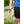 Person holding a white Gobi wearable neck fan outdoors