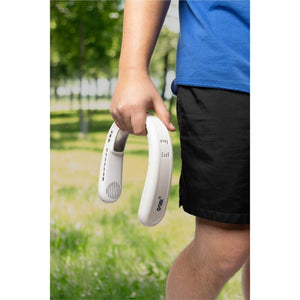 Person holding a white Gobi wearable neck fan outdoors