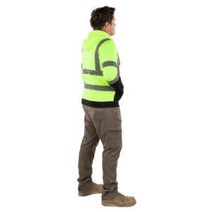 Man wearing Gobi Heat high visibility yellow hooded sweatshirt with reflective stripes and brown work pants