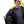 Man wearing a Gobi Heat black jacket with a high visibility yellow hood lining