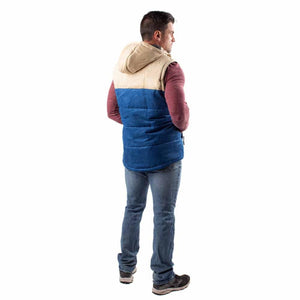 Man wearing a blue and tan Gobi Heat hooded puffer vest from the back