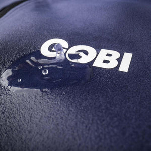 Water beading on a navy blue fabric with a white Gobi logo