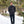 Man wearing a black Gobi Heat puffer jacket standing in a snowy forest