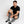 Man wearing Gobi Heat grey heated socks while sitting on the floor