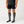 Person wearing Gobi Heat grey knee high socks with battery pocket