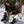 Woman wearing Gobi Heat jacket and heated socks sitting in a folding chair in the snow