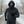 Person wearing a Gobi Heat charcoal fleece hoodie and face mask running on a snowy path