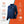 Gobi Heat blue jacket with icons showing temperature, water resistance, washability, and recharge time