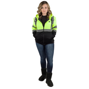 Woman wearing a high visibility yellow and black hooded work jacket with reflective stripes