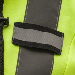 Close up of reflective grey strip on neon yellow high visibility fabric