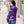 Woman wearing a purple Gobi Heat quilted vest over a plaid shirt