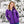 Woman wearing a purple Gobi Heat softshell jacket in a snowy outdoor setting