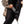 Person placing a black power bank into the interior pocket of a camouflage heated jacket