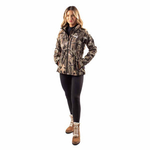 Woman wearing a Gobi Heat camo print heated jacket with black leggings and brown winter boots