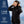 Woman wearing Gobi Heat black heated jacket with 10 hour battery life three heat settings and one year warranty