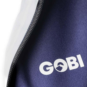 Close up of Gobi Heat logo on dark blue fabric with zipper