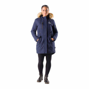 Woman wearing a navy blue Gobi Heat parka with a faux fur hood