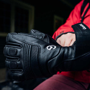 Person wearing black Gordini leather gloves with protective padding