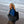 Person carrying a black Got Bag tote on the beach
