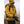 Person wearing a yellow jacket and Hestra black gloves outdoors