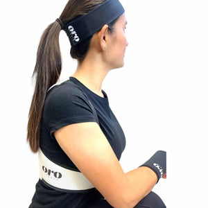 Person wearing Oro Sports black headband and white waist belt