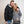 Man and woman wearing Venture Heat zip up hoodies in black and grey