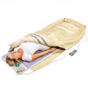 Person lying on a HealthyLine infrared sauna mat with a digital controller
