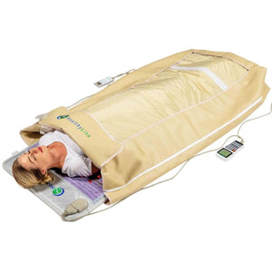Woman lying inside a HealthyLine infrared sauna blanket with a digital controller