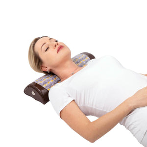 Woman lying on a HealthyLine gemstone neck pillow